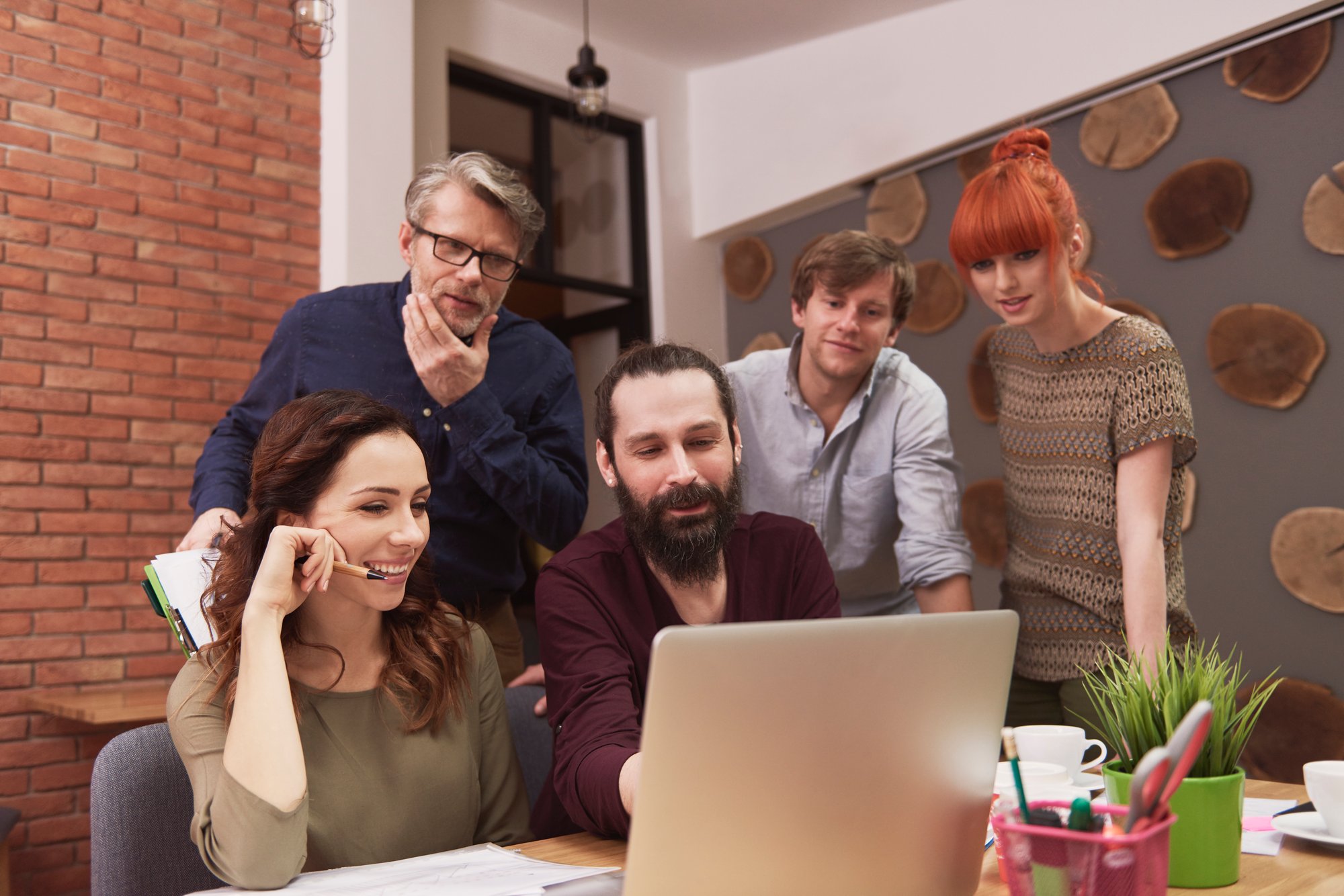 group-creative-people-analyzing-result-work